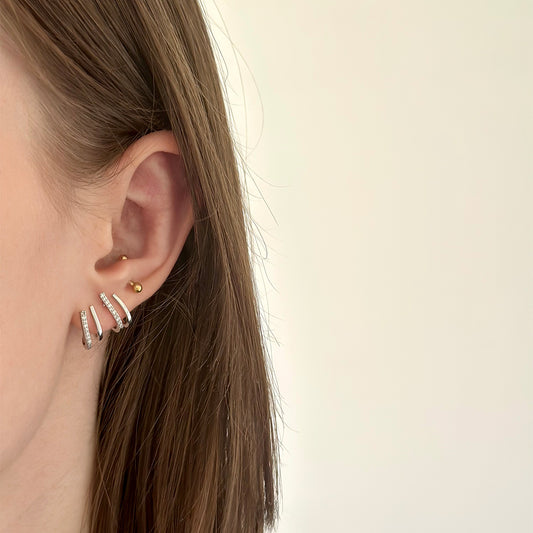 Paire de boucles d'oreilles argentées en acier inoxydable effet plusieurs trous