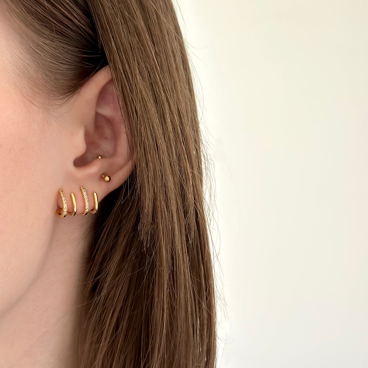 Paire de boucles d'oreilles dorées en acier inoxydable effet plusieurs trous