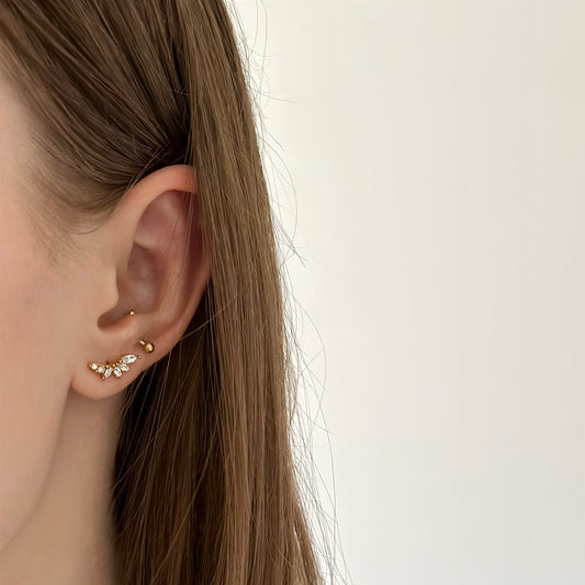 Boucle d'oreille en acier inoxydable dorée avec des pierres