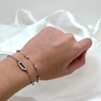 Bracelet argenté en acier inoxydable et avec des petites perles avec un bracelet à stras de Jeana Jewelry